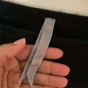 Melissa McCarthy black poncho